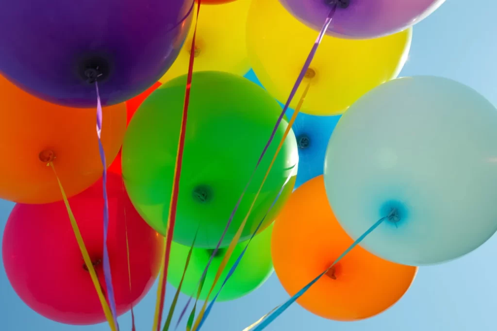 bunch-of-colorful-helium-balloons-against-blue-sky
