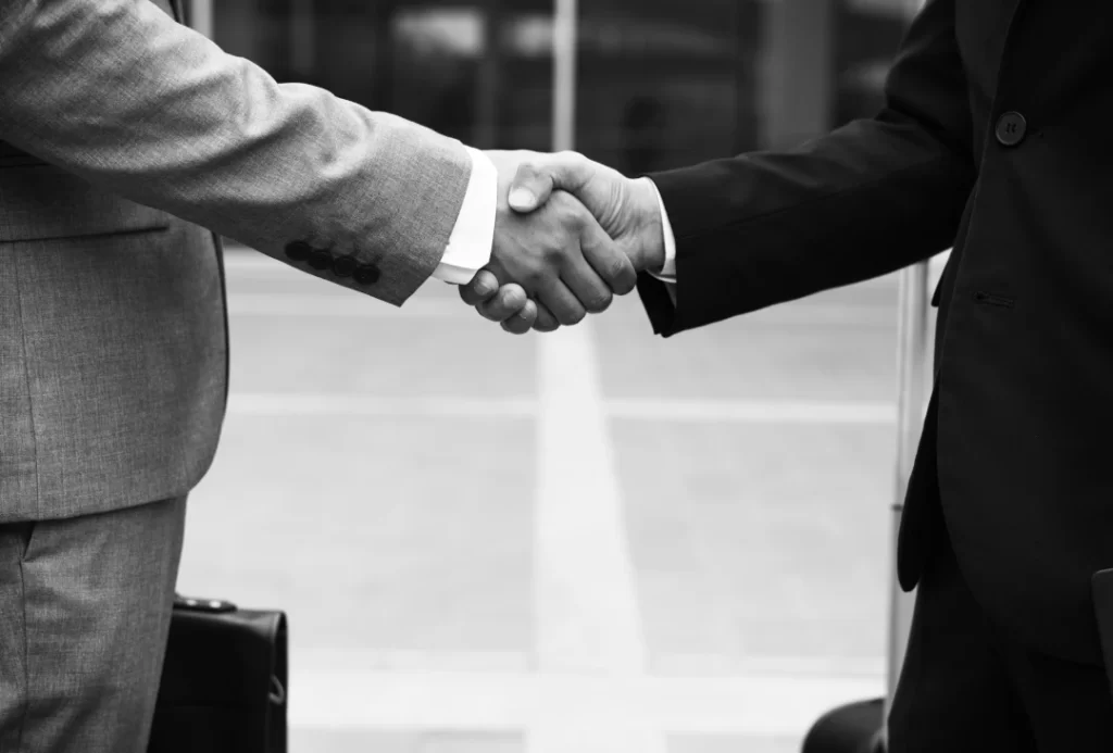 businessmen-conclude-deal-with-handshake