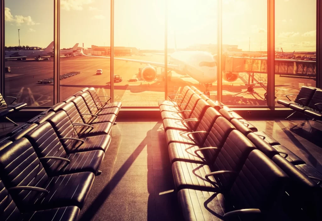 empty-seats-in-an-airport-departure-hall-at-sunset