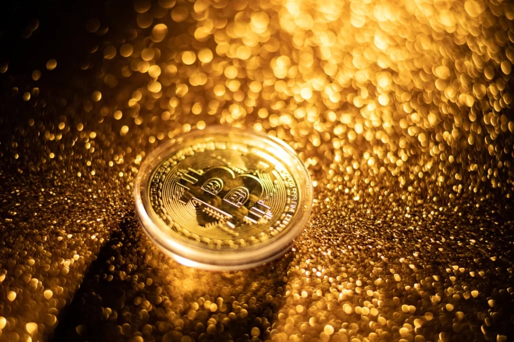 gold-bitcoin-coin-on-shimmering-golden-background